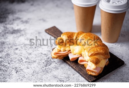 Ham cheese scrambled eggs croissant for breakfast. toning Royalty-Free Stock Photo #2276869299