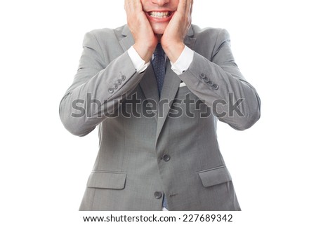 Young business man over white background. Looking funny