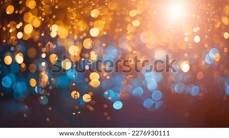Blue and golden glitter In shiny defocused abstract background, blur Christmas lights