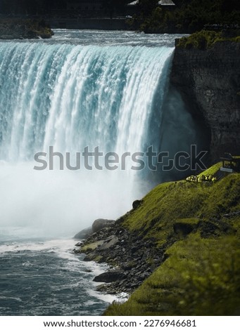 close up photo of Niagara Falls with a place for caption, Niagara Falls in the summer season is full of water