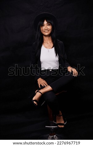 portrait shot of young happy asian or vietnamese woman, enjoying lifestyle, joy, happiness, photo on black background.