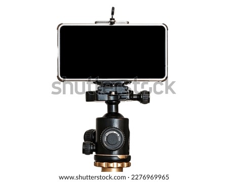 Mobile phone on a tripod, white isolated background. blank black screen. copy space