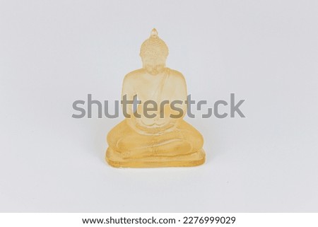 Buddha statue on white background, closeup of photo.