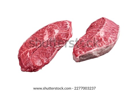 Raw Top Blade or flat iron beef meat steaks on a butcher table. Isolated on white background. Royalty-Free Stock Photo #2277003237