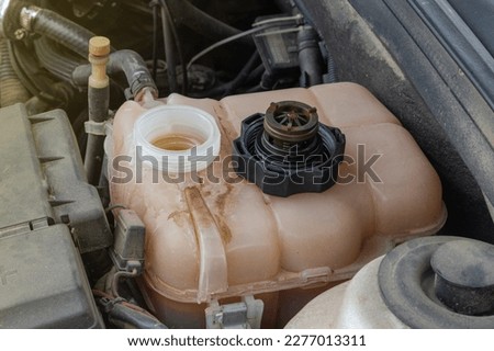 Rust stains and engine oil leaks in car radiators. Royalty-Free Stock Photo #2277013311