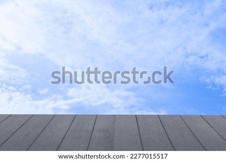 Empty wooden table top isolated on sky background, used for display or montage your products.