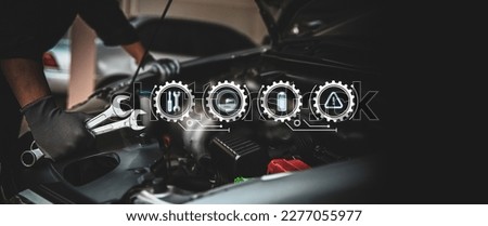Car care maintenance and servicing, Hand technician auto mechanic using the wrench to fix car or repairing change spare part engine problem and insurance service support the range of car check. Royalty-Free Stock Photo #2277055977