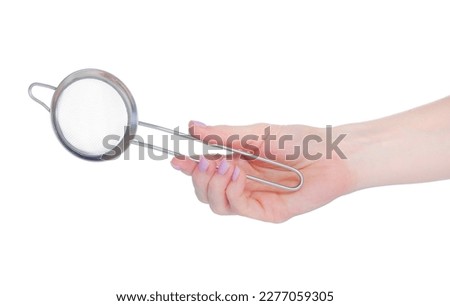 Metal small sieve in hand on white background isolation