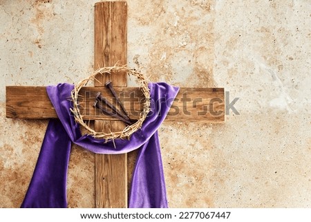 Lent season, Holy week and Good friday concept. Cross With three Nails And Crown Of Thorn on stone background Royalty-Free Stock Photo #2277067447
