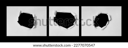 torn paper frame with the ripped sides. a black hole of torn on the white paper. realistic torn paper with the ripped edges for copy space background Royalty-Free Stock Photo #2277070547
