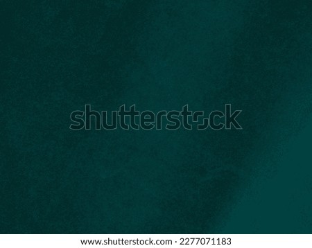 Dark green velvet fabric texture used as background. Empty green fabric background of soft and smooth textile material. There is space for text.