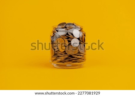 Savings in a glass bottle; savings; salary; income from work savings concept