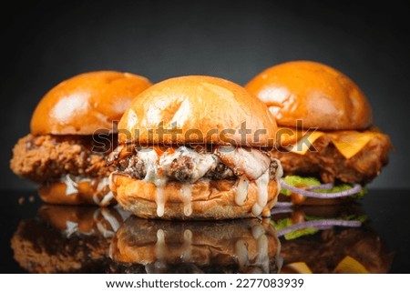 Homemade burgers on dark background. Royalty-Free Stock Photo #2277083939