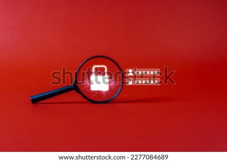 Data privacy concept: magnifying glass. Lock with magnifying glass cracking. User information by scanning on a red background.