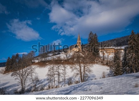 Small church in St. Magdalena or Santa Maddalena in Geislergruppe or Gruppo dele Odle Italian Dolomites Alps mountains. January 2023 Royalty-Free Stock Photo #2277096349