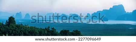 Panoramic wonderful landscape of nature and twilight sunrise sky at Samet Nangshe viewpoint, Phang Nga, Hilltop viewpoint, a cafe overlooking, Andaman sea paradise landscape and wonderful viewpoint Royalty-Free Stock Photo #2277096649