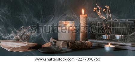 Tarot, astrology,Esoteric, Occult mystical ritual scene of sorcery tarot candles,dried flowers, palo santo tarot cards, ritual book.Witchcraft,mysticism and occultism,esoteric background,tarot banner Royalty-Free Stock Photo #2277098763