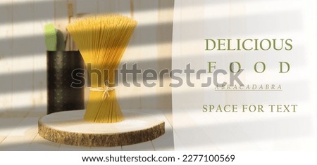 A bunch of dry spaghetti pasta in a stack horizontally. A pile of raw Italian pasta on a wooden background. copy space. Side view