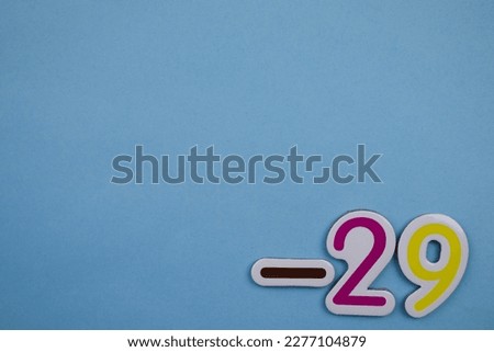 -29 is a colorful photo of -29, taken from above, placed on the edge of a blue background.