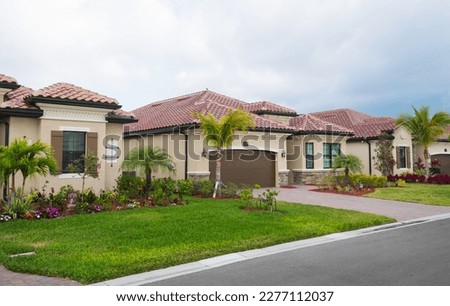 Cloudy day in new golf community, Bonita Springs, Florida. Real estate background concept Royalty-Free Stock Photo #2277112037