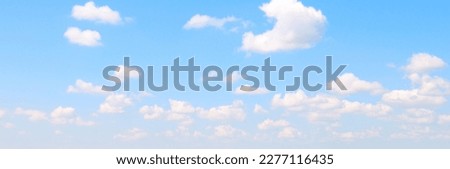 Blue sky with beautiful white clouds. Wide photo. Royalty-Free Stock Photo #2277116435