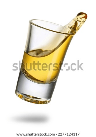 falling tequila shot with splash isolated on white background Royalty-Free Stock Photo #2277124117
