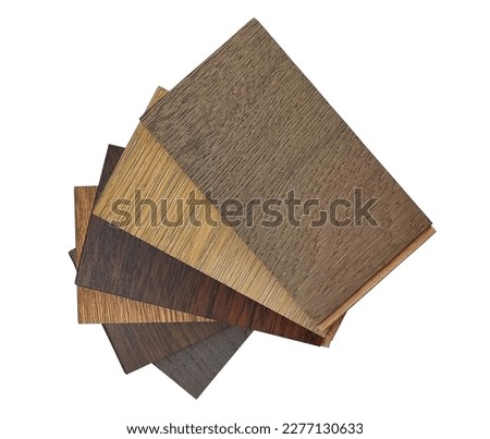 top view of stacked of wooden laminated flooring tiles sample for interior renovation isolated on background with clipping path. engineering floor tiles samples. construction materials. Royalty-Free Stock Photo #2277130633