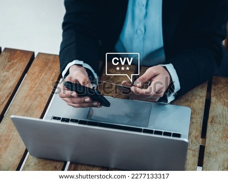 CVV code in speech bubble appears while businesswoman using smart phone and holding credit or debit card, paying for shopping online. Secure payment, safety banking transaction mobile application. Royalty-Free Stock Photo #2277133317