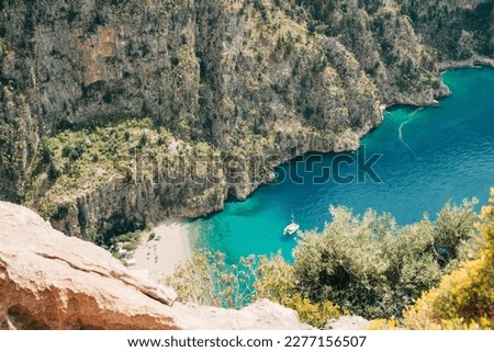 Scenic seascape view of a sea bay surrounded with mountains. Peaceful landscape picture of coastline taken from the mountain top