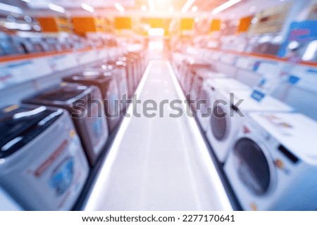 Blurred background of large household appliances and furniture store