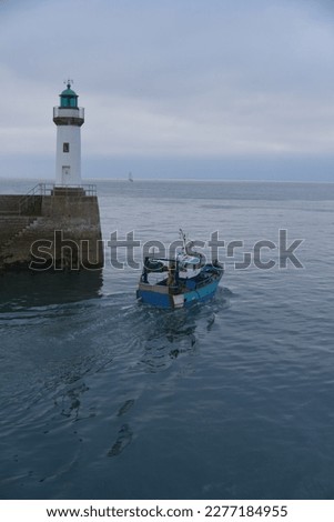 pictures of a little fishing boat living the harbor of belle-il-en-mer (FRANCE)