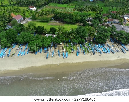 Aerial view of boats moored off Rajegwesi Beach. Banyuwangi. Indonesia. Photo taken with drone.
