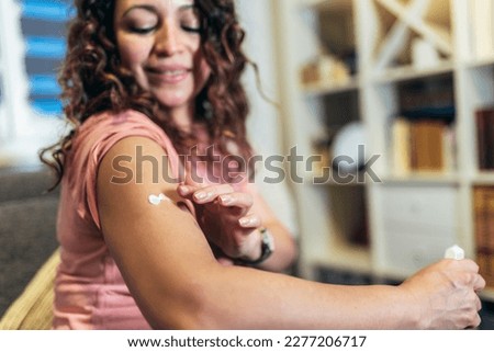 Woman at home using products for hormone replacement therapy. Royalty-Free Stock Photo #2277206717