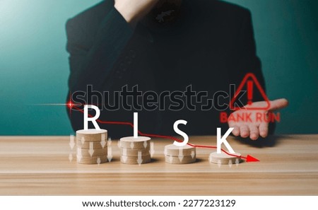 Businessman falling financial graph chart from bank run Phenomenon with words Risk. Fall of startups, Stock, Bitcoin , Cryptocurrency, bankruptcy, failure, defeat, banking, money, recession concept. Royalty-Free Stock Photo #2277223129
