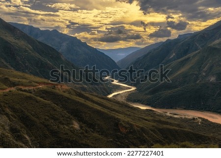 Chicamocha river on a cloudy sunset Royalty-Free Stock Photo #2277227401