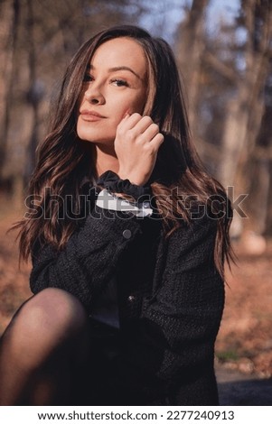 beautiful young woman in autumn park