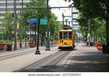 Yellow electric trolleys on Main Street in downtown Memphis, Tennessee in summer Royalty-Free Stock Photo #2277249247