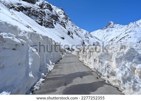 Road vanishing in snowy landscape