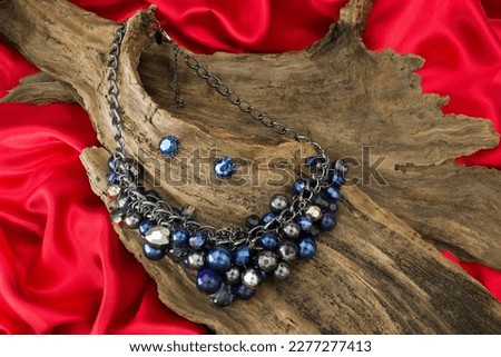 necklace isolated on wooden  background.