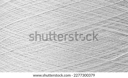 Close up texture picture of sew thread spool gray silver color, macro background Royalty-Free Stock Photo #2277300379