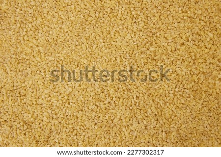 bulgur wheat background. bulgur wheat texture. top view Royalty-Free Stock Photo #2277302317
