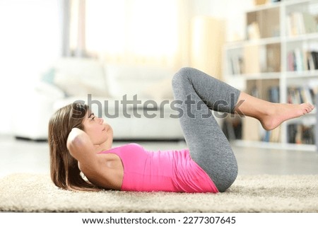 Side view portrait of a teen practicing exercises at home