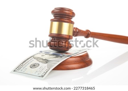 gavel of justice on the background of dollars. corruption in law. buying a judgment