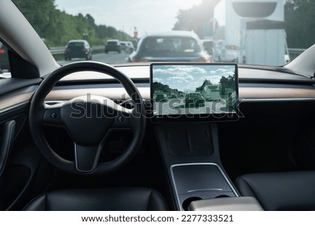 Self driving car on a road. Autonomous vehicle. Inside view. Royalty-Free Stock Photo #2277333521