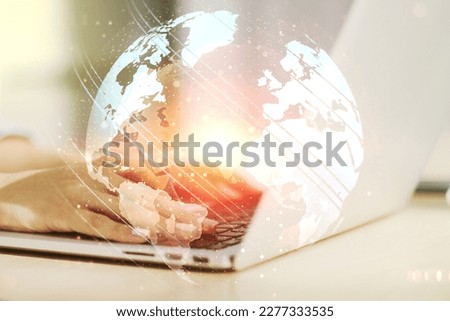 Multi exposure of abstract creative digital world map and hand typing on computer keyboard on background, research and analytics concept