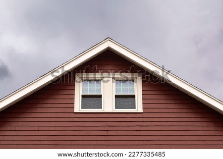 Gable house roof attic window exterior view, Boston city, MA, USA Royalty-Free Stock Photo #2277335485