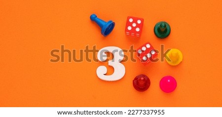 Number 3 with dice and board game pieces - Orange eva rubber background