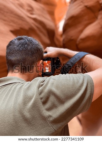 Antelope Canyon X is a slot canyon in Page, Arizona, USA, located in the exact same Antelope Canyon as the famous Upper and Lower Antelope Canyons. Nature photographer taking pictures outdoors.