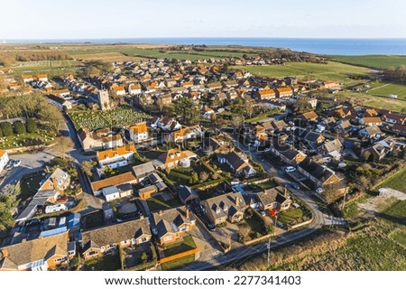 high angle view of small and pretty houses and fields in Flamborough village, United Kingdom. High quality photo