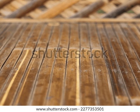 Brown bamboo floor background. perfect for background for product photography or other any design purposes.  Royalty-Free Stock Photo #2277353501